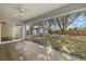 Spacious screened-in patio overlooking the backyard with shed at 5113 Weatherton St, North Port, FL 34288