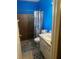 Compact bathroom featuring a step-in shower, vanity with sink, and tiled flooring at 5240 Malamin Rd, North Port, FL 34287