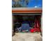 Open garage filled with tools, equipment, and various stored items at 5240 Malamin Rd, North Port, FL 34287