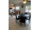 Open kitchen with stainless appliances, tiled flooring, a large island, and plenty of natural light at 5240 Malamin Rd, North Port, FL 34287