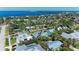 Stunning aerial view of neighborhood with lush greenery, waterfront views, and charming homes at 621 Trabue Ave, Punta Gorda, FL 33950