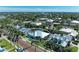 Aerial shot showcasing the property's location within a lush, tropical neighborhood surrounded by palm trees at 621 Trabue Ave, Punta Gorda, FL 33950