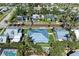 Aerial view of home showcasing landscaped yard, inviting pool, and lush surroundings at 621 Trabue Ave, Punta Gorda, FL 33950