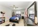 This bedroom offers natural light, neutral walls and flooring, and fun sports-themed décor at 621 Trabue Ave, Punta Gorda, FL 33950