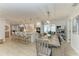 Open kitchen and dining area featuring a large island, modern appliances, and stylish dining set at 621 Trabue Ave, Punta Gorda, FL 33950