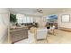 Bright living area with a cozy sectional, chic decor, and a mounted TV for modern living at 621 Trabue Ave, Punta Gorda, FL 33950
