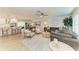 Spacious open-concept living area with modern decor, wood-look floors, and ample natural light at 621 Trabue Ave, Punta Gorda, FL 33950