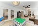 Bright playroom with French doors, shiplap walls, playing table and shelves for seamless playtime experience at 621 Trabue Ave, Punta Gorda, FL 33950