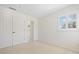 Light and bright bedroom with plush carpet and access to the ensuite bath at 726 Connemara Ct, Venice, FL 34292