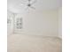 Bright, spacious bedroom with neutral carpet, ceiling fan and plantation shutters at 726 Connemara Ct, Venice, FL 34292