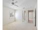 Bedroom with carpet, ceiling fan, ensuite and walk-in closet at 726 Connemara Ct, Venice, FL 34292