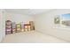 Light-filled bedroom with a window and plenty of space for storage boxes at 726 Connemara Ct, Venice, FL 34292