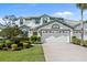 Charming two-story home featuring a well-maintained lawn and a spacious two-car garage at 726 Connemara Ct, Venice, FL 34292