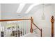 Open foyer with wood railing overlooking the living room at 726 Connemara Ct, Venice, FL 34292