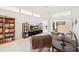 Comfortable living room with high ceilings, a ceiling fan, and large sliding glass doors at 726 Connemara Ct, Venice, FL 34292
