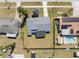 Aerial view of the property showcasing the house, yard, and swimming pool at 8326 Fay Ave, North Port, FL 34287