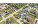 Residential neighborhood showcases a home with a screened-in pool, well-maintained landscaping at 20343 Rutherford Ave, Port Charlotte, FL 33952