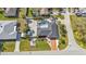 Aerial view of home showcasing the backyard pool, patio, shed, and verdant lawn at 20343 Rutherford Ave, Port Charlotte, FL 33952