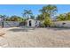 Landscaped backyard with a storage shed and gravel groundcover at 20343 Rutherford Ave, Port Charlotte, FL 33952