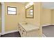 This well-lit bathroom features neutral-toned walls, a modern vanity, and tiled floors at 20343 Rutherford Ave, Port Charlotte, FL 33952