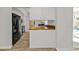 The kitchen features stainless steel appliances, butcher block countertops, and white cabinetry at 20343 Rutherford Ave, Port Charlotte, FL 33952