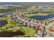 An aerial view showcasing a beautiful residential community, interspersed with lakes, golf courses, and mature trees at 1321 Eagles Flight Way, North Port, FL 34287