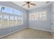 Light filled bedroom with large windows with shutters that offer picturesque views at 1321 Eagles Flight Way, North Port, FL 34287