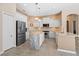 Modern kitchen with stainless steel appliances, granite countertops, and white cabinetry at 1321 Eagles Flight Way, North Port, FL 34287