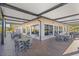 Covered outdoor dining area perfect for enjoying meals with views of the community's beautiful landscaping at 1321 Eagles Flight Way, North Port, FL 34287