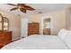 Bedroom featuring a wooden dresser and a view of the bathroom at 1489 Kedron Ln, Punta Gorda, FL 33983