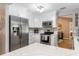 Modern kitchen featuring stainless steel appliances, white cabinetry, and quartz countertops at 1489 Kedron Ln, Punta Gorda, FL 33983