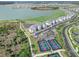 Aerial showcasing the community's beautiful landscaping, tennis courts and lakeside condos at 15970 Grassland Ln # 2816, Punta Gorda, FL 33982