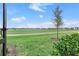 Serene backyard with a view of the lush green golf course at 15970 Grassland Ln # 2816, Punta Gorda, FL 33982