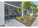 Charming exterior with lush landscaping and a screened-in patio at 15970 Grassland Ln # 2816, Punta Gorda, FL 33982
