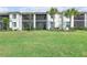 Backyard with a screened-in lanai and a beautiful lawn at 15970 Grassland Ln # 2816, Punta Gorda, FL 33982