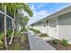 Beautifully landscaped exterior with a paved walkway and lush greenery at 15970 Grassland Ln # 2816, Punta Gorda, FL 33982
