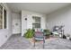 Inviting front porch with a seating area and well-manicured landscaping at 15970 Grassland Ln # 2816, Punta Gorda, FL 33982