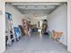 Spacious garage with epoxy floor and ample storage space for vehicles and other items at 15970 Grassland Ln # 2816, Punta Gorda, FL 33982