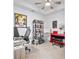 Comfortable home office with modern desk, seating, and a vibrant red piano at 15970 Grassland Ln # 2816, Punta Gorda, FL 33982