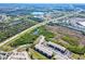 Aerial view showing the complex's proximity to highways, retail areas, and green spaces at 175 Kings Hwy # 232, Punta Gorda, FL 33983