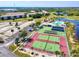 Aerial view of the condo complex featuring a swimming pool, tennis courts and recreation area at 175 Kings Hwy # 232, Punta Gorda, FL 33983