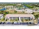 Beautiful aerial view of condo complex featuring luscious landscaping, ponds, and community amenities at 175 Kings Hwy # 232, Punta Gorda, FL 33983