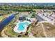 Aerial view of the condo complex featuring a swimming pool and tennis courts at 175 Kings Hwy # 232, Punta Gorda, FL 33983