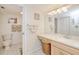 Well-lit bathroom features a spacious vanity and a separate toilet area for privacy at 175 Kings Hwy # 232, Punta Gorda, FL 33983