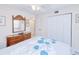 Charming bedroom with ample storage, bright lighting and a comfortable bed at 175 Kings Hwy # 232, Punta Gorda, FL 33983