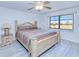 Bright bedroom with a large window and a decorative ceiling fan at 175 Kings Hwy # 232, Punta Gorda, FL 33983