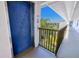Condo elevator with community view of manicured landscaping, palm trees and blue skies at 175 Kings Hwy # 232, Punta Gorda, FL 33983
