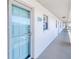 Condo front door entrance featuring white stucco exterior and a bright blue door at unit 232 at 175 Kings Hwy # 232, Punta Gorda, FL 33983