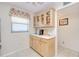 Bright kitchen includes tile floors, shaker style cabinets, and bright window coverings at 175 Kings Hwy # 232, Punta Gorda, FL 33983
