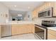 Eat-in Kitchen with stainless steel appliances, ample countertop space, and open floor plan at 175 Kings Hwy # 232, Punta Gorda, FL 33983